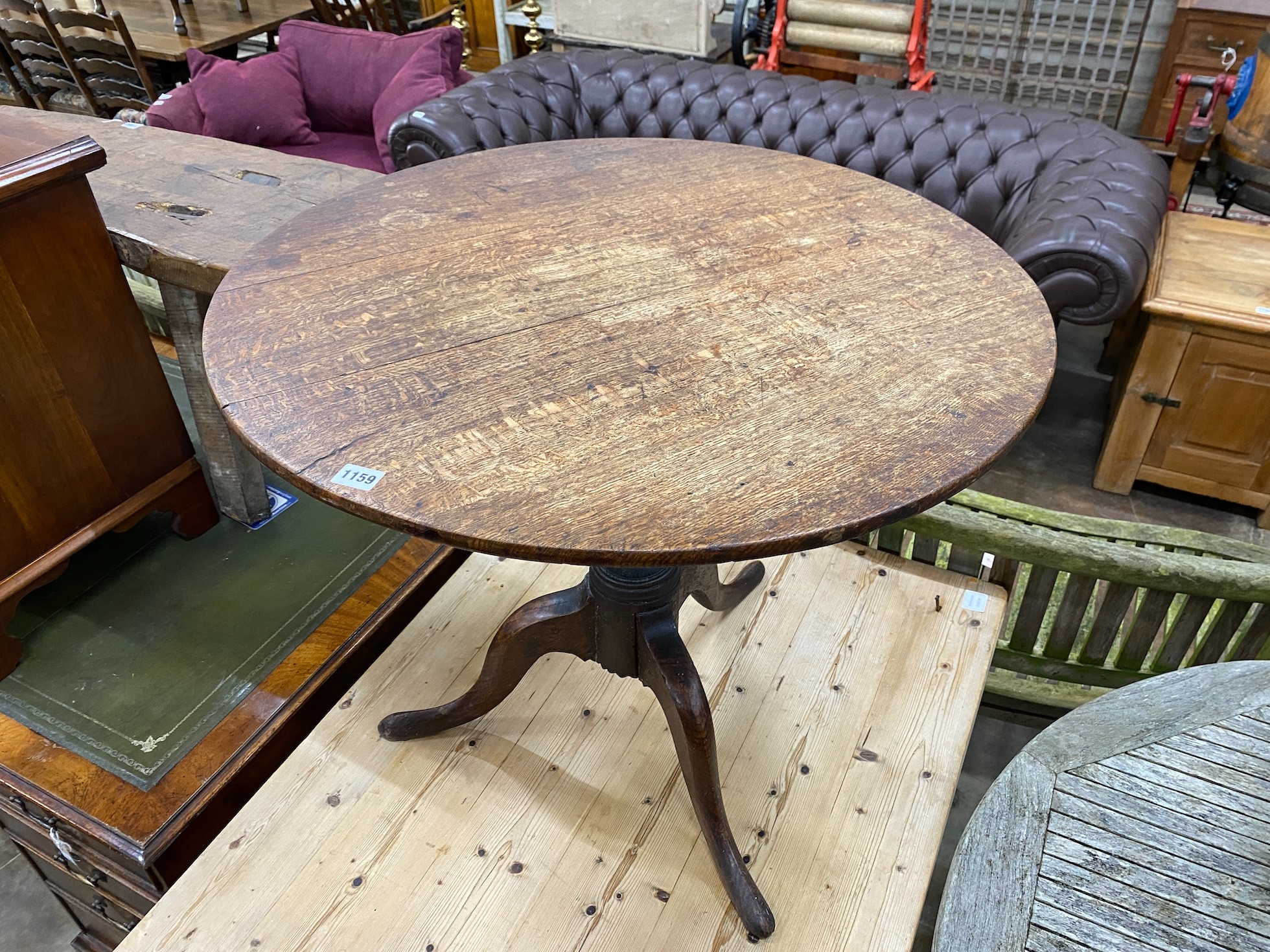 A George III style circular oak tripod tea table, diameter 76cm, height reduced 67cm *Please note the sale commences at 9am.